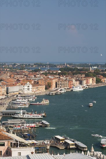 Water taxis and vaporettos along the Riva degli Schiavoni promenade plus old Renaissance