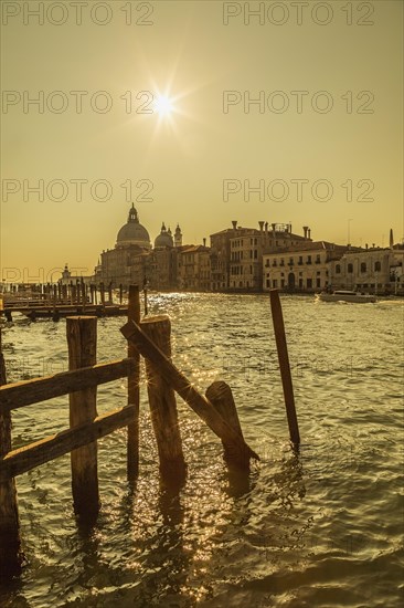 Silhouetted view of Grand canal with water taxis and Santa Maria della Salute basilica in