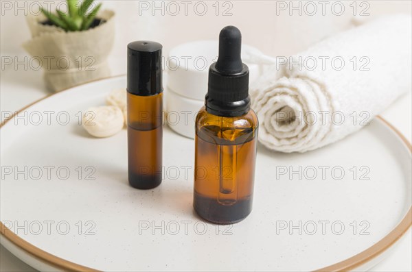 Cosmetic packaging. Set of different cosmetics on plate with decoration. Skin care concept