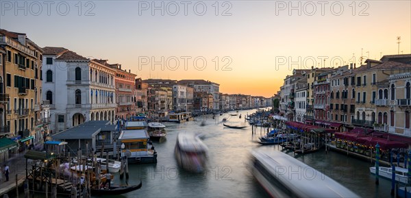 Vaporettos on the Grand Canal at sunset, long exposure, view from the Rialto Bridge, Venice,