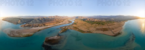 Panorama, River mouth of the Naryn River at Toktogul Reservoir at sunset, aerial view, Kyrgyzstan,