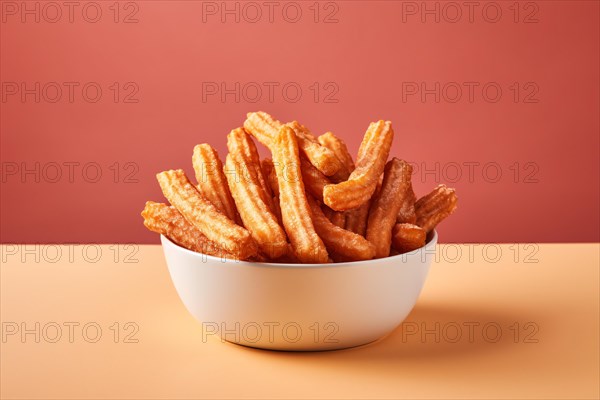 Churros in bowl, a fried dough dessert from Spanish and Portuguese cuisine. KI generiert,