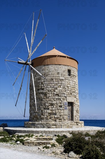 Windmill on the pier at Mandraki Oat, Rhodes Town, Rhodes, Dodecanese, Greece, Europe