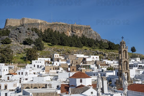 View of the Acropolis and the white houses of Lindos, Rhodes, Dodecanese archipelago, Greek