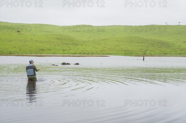 Black bass fisherman fishing with flyfishing, Cambara do sul, Rio Grande do sul, Brazil, South