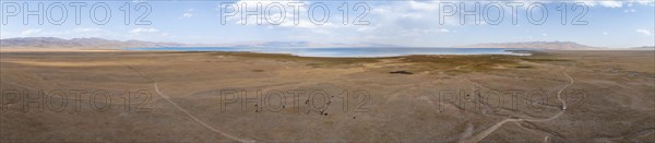 Aerial view, Vast empty landscape at the mountain lake Song Kul in autumn, Moldo Too Mountains,