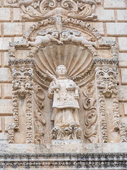 Figure of a saint, relief on the facade of San Nicola Cathedral, Cattedrale Turritana Sassari,