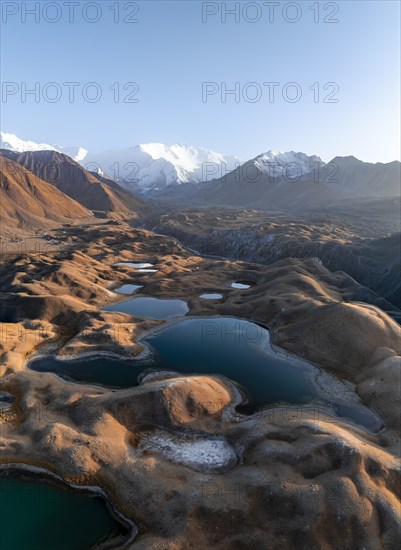 Aerial view, high mountain landscape with glacial moraines and mountain lakes, behind Pik Lenin,