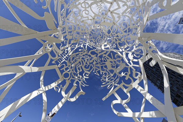 Public art, frog perspective of source sculpture by Jaume Plensa, Montreal, Province of Quebec,