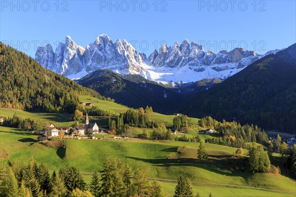 A small church in the midst of an autumnal mountain landscape in South Tyrol, Italy, Trentino-Alto