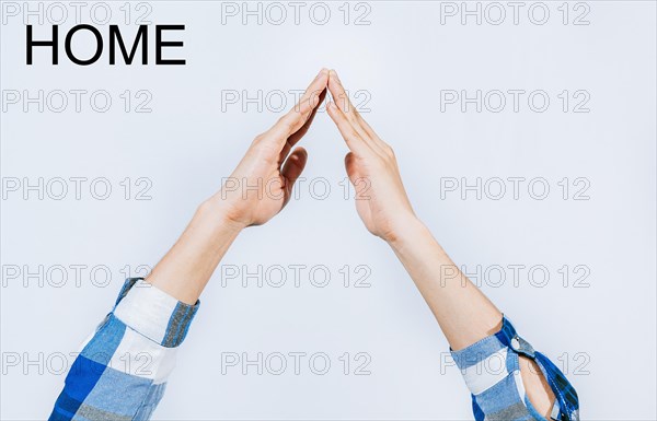 Man hands making house roof shape isolated. Hands of person gesturing roof of house isolated