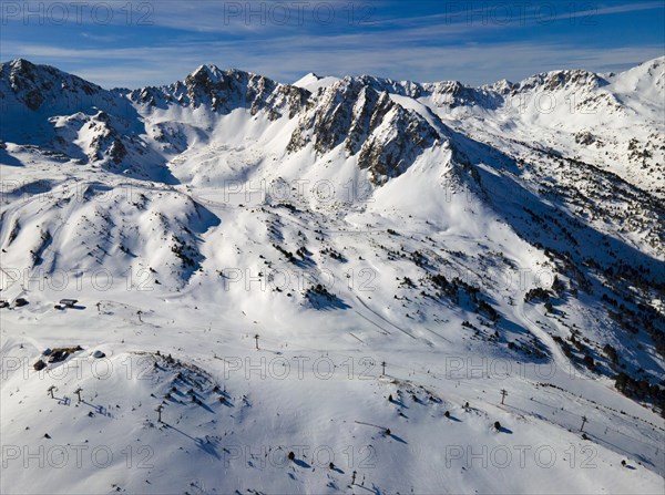 Panoramic view of snow-covered mountains with ski lifts, Grau Roig, Encamp, Andorra, Pyrenees,
