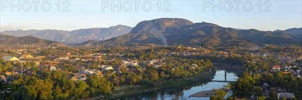 Panorama over Luang Prabang with Nam Khan River and Wat Phol Pao in the background, Laos, Asia