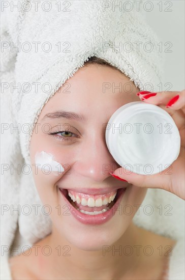 Skincare, product and woman with cream on face, and excited advertising luxury skin care promotion.