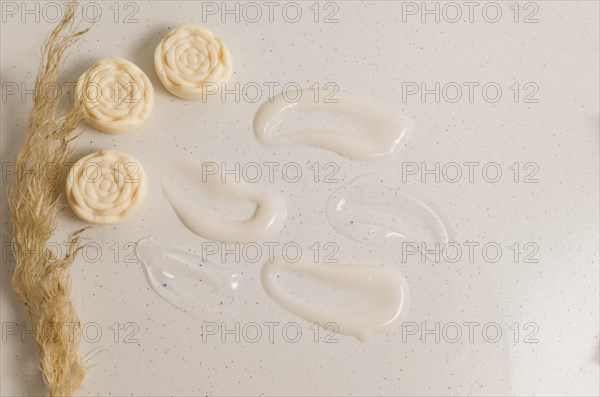 Cosmetic smears of creamy texture on a beige background