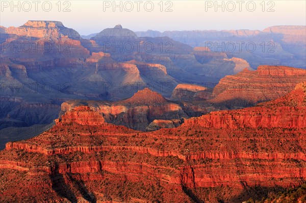 The Grand Canyon presents itself in red and purple colours at dusk, Grand Canyon National Park,