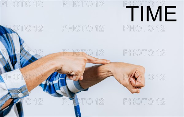 Person hand making TIME ASL American sign language. Hand making TIME gesture in sign language