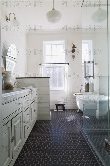 White antique style finish vanity with quartz countertop and two sunken sinks, freestanding claw