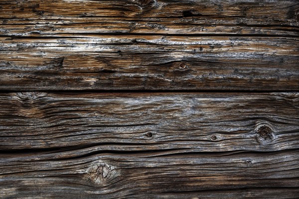 Old wooden beams on the house facade of the Naturalpe Gemstel-Schoenesboden-Alpe, Gemsteltal,
