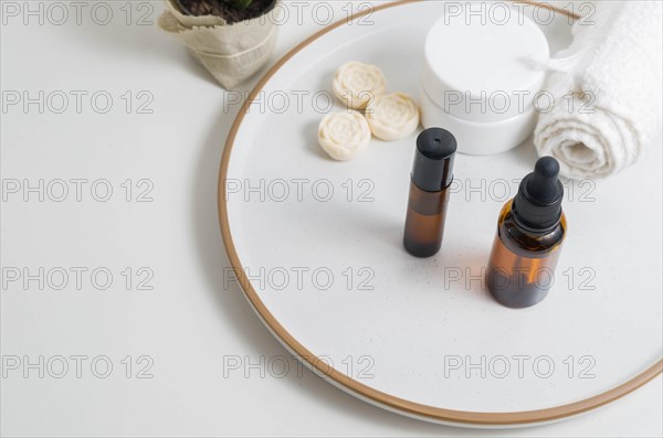 Cosmetic packaging. Set of different cosmetics on plate with decoration. Skin care concept
