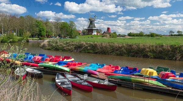 The Greetsiel twin mills, in front boats in the new Greetsieler Sieltief, Greetsiel, Krummhoern,