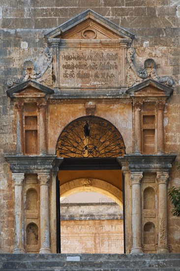 Stone steps and arched entrance with Doric columns at Holy Trinity (Agia Triada) Monastery,