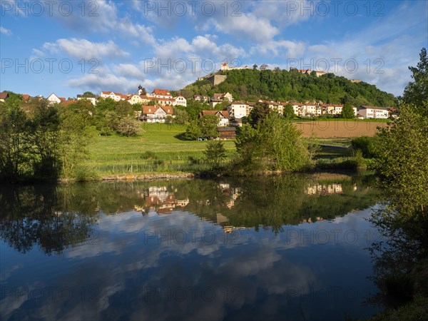 Reflection in a pond, Riegersburg in the morning light, Riegersburg, Styrian volcanic region,