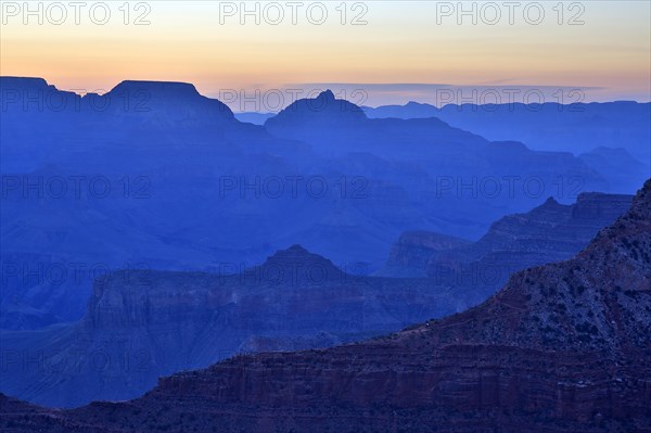 The twilight cloaks the Grand Canyon in a deep blue and emphasises the contours, Grand Canyon
