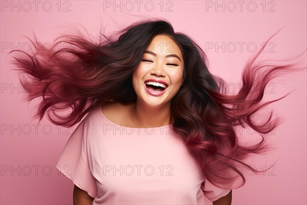 Smiling Asian plus size woman with long pink and black ombre hair. KI generiert, generiert, AI