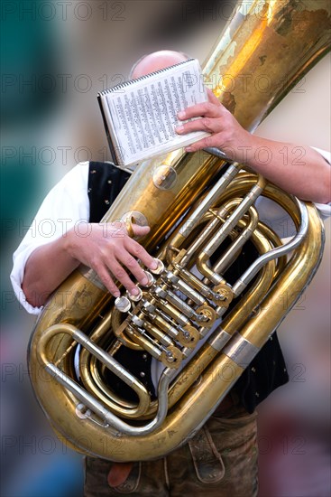 Tuba players in traditional traditional costume, lederhosen, at the spring festival in Deggendorf,