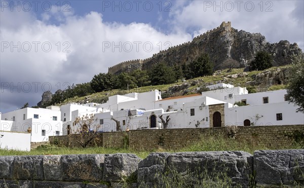 View of the Acropolis and the white houses of Lindos, Rhodes, Dodecanese archipelago, Greek