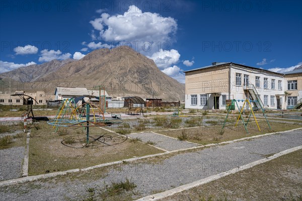 Playground equipment in a playground, ghost town, Engilchek, Tian Shan, Kyrgyzstan, Asia