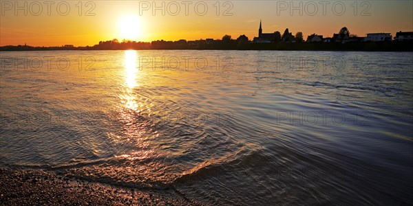 Sunset over the Rhine in Neuss with a view of Volmerswerth in Duesseldorf, Lower Rhine, North