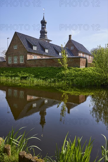Moat with reflection of the castle in front of Husum, North Frisia district, Schleswig-Holstein,