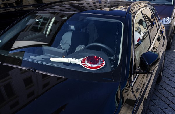 Parked police vehicle with red stop stick behind the windscreen, Berlin, Germany, Europe