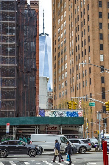 The One World Trade Centre can be seen at the end of a street canyon, Lower Manhattan, New York