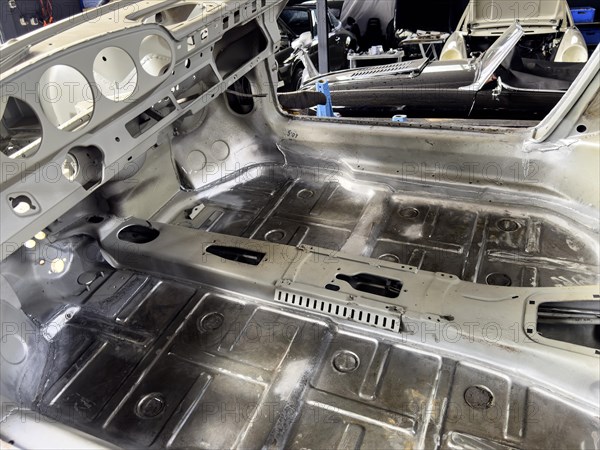 Gutted restored freshly galvanised partially galvanised passenger compartment empty interior of