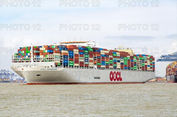 OOCL Zeebrugge container ship leaving quayside departing from Port of Felixstowe, Suffolk, England,