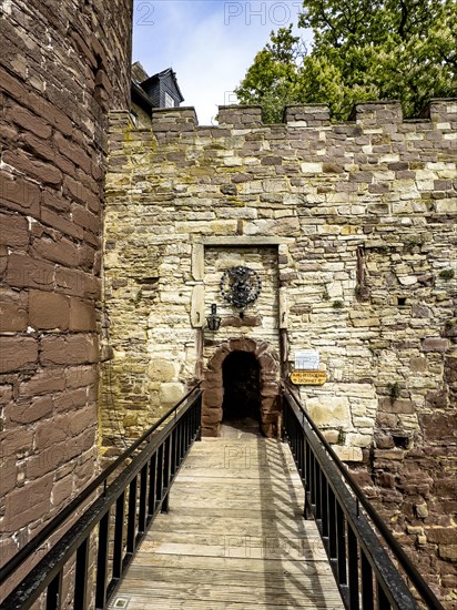 View over a fortified bridge to a small, narrow castle courtyard of the 13th century Trendelburg