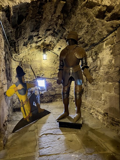 Medieval knight's armour on display inside the 13th century castle tower, Trendelburg,