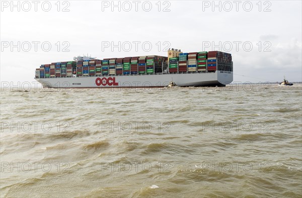 OOCL Zeebrugge container ship leaving departing from Port of Felixstowe, Suffolk, England, UK