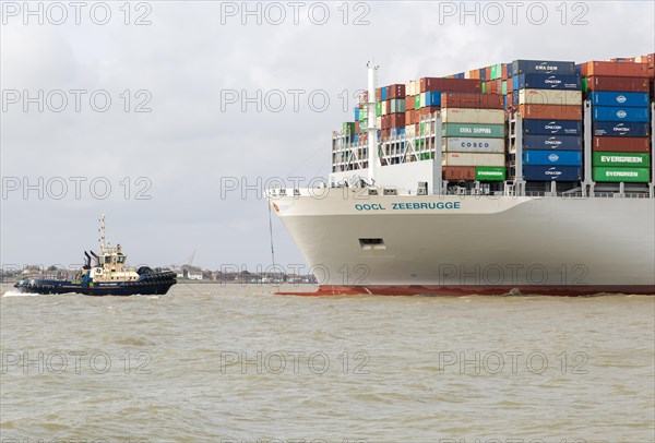 OOCL Zeebrugge container ship leaving quayside departing from Port of Felixstowe, Suffolk, England,