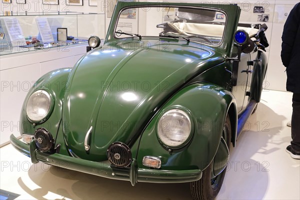 A green Volkswagen Beetle Cabriolet in shiny condition stands in the museum, AUTOMUSEUM PROTOTYP,