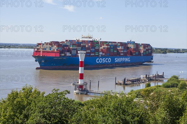 Cosco container ship and lighthouse on the Elbe, Blankenese district, Hamburg, Germany, Europe