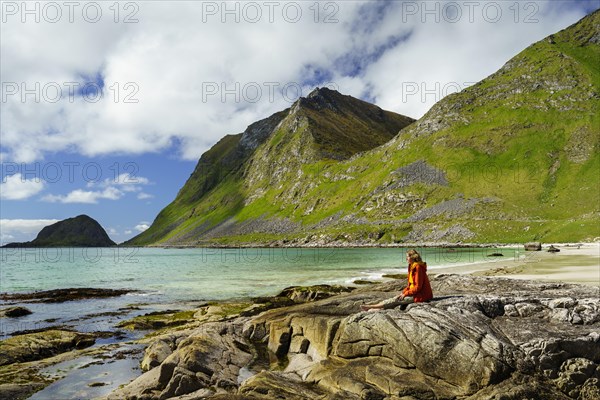 Landscape with sea at the sandy beach of Haukland (Hauklandstranda) with the mountain Veggen. A