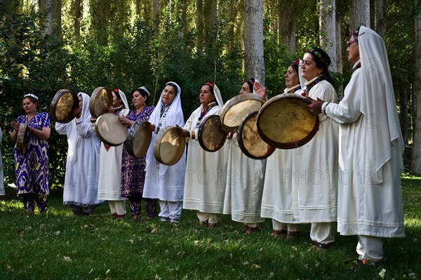 Pamiri women playing music, roof of the world festival, Khorog, Tajikistan, Central Asia. All the