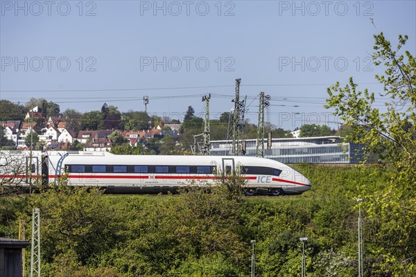 Deutsche Bahn AG InterCityExpress ICE en route, railway embankment and overhead lines,