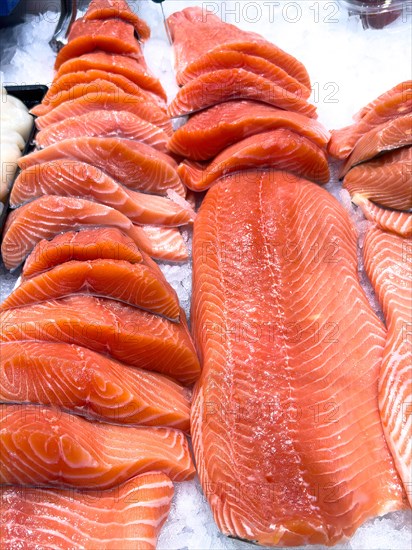 Display of Pacific salmon (Oncorhynchus) caught by fishing in the form of salmon fillet on ice in