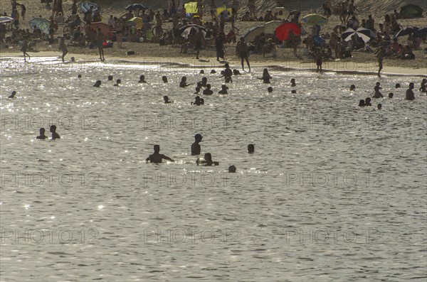 Montevideo, Uruguay, 11th January 2022, Beautiful sunset on Pocitos beach with bathers on a summer