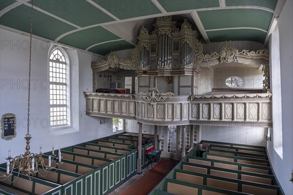 Protestant Reformed Church from 1401, interior with pews and organ prospectus above the east